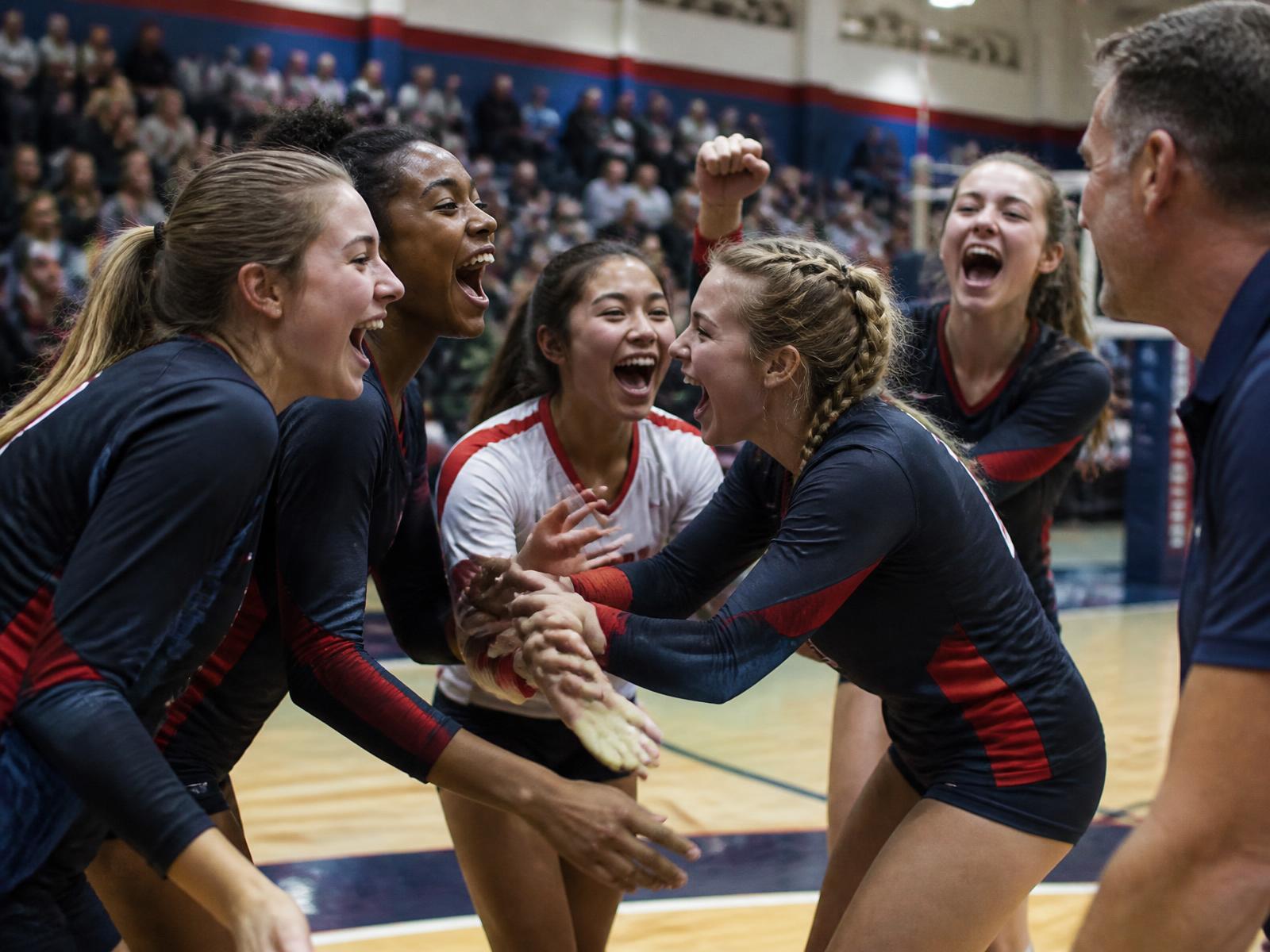 High school athletes celebrating together after a game